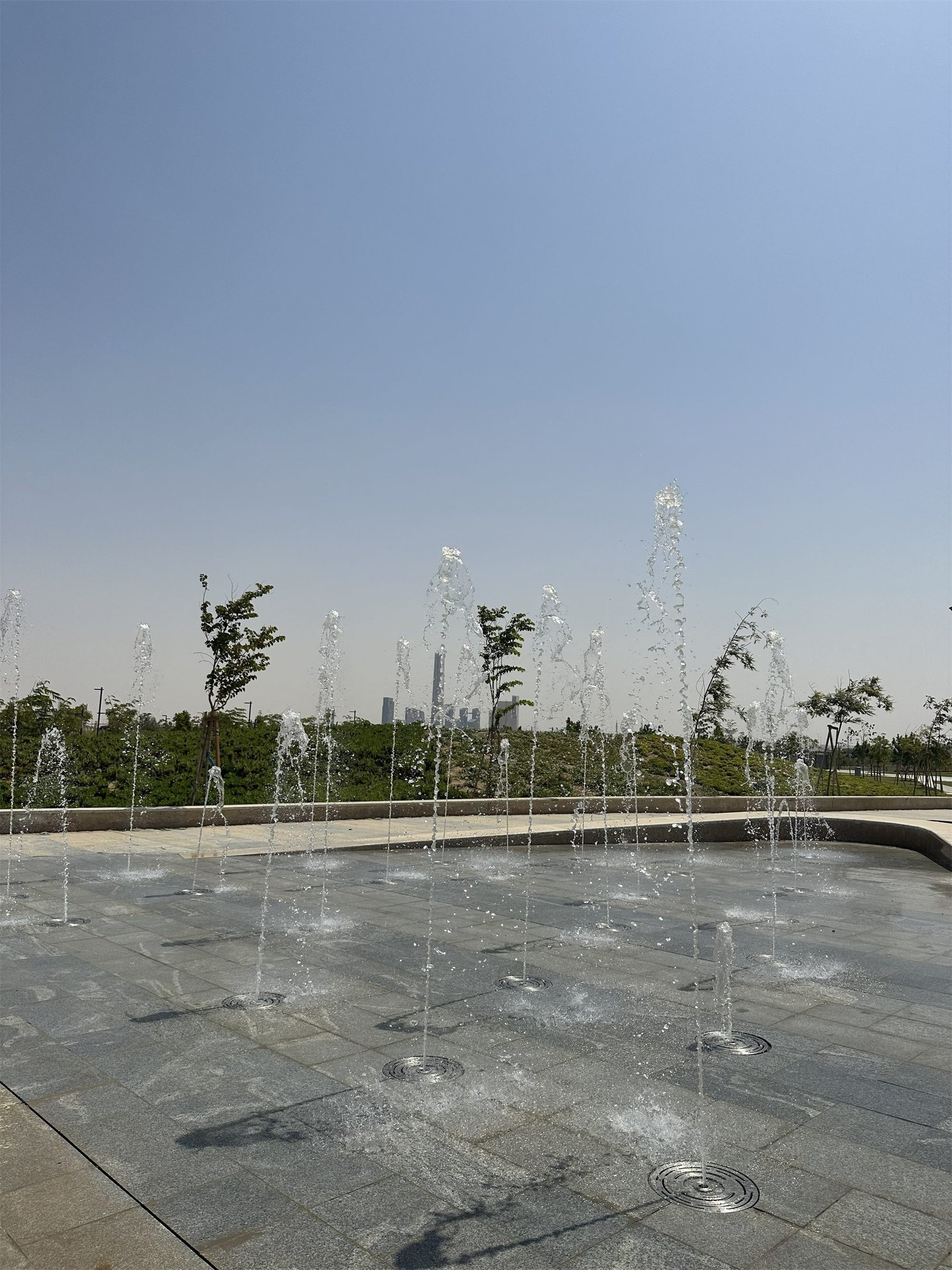 Feature fountain jets rising from the paving