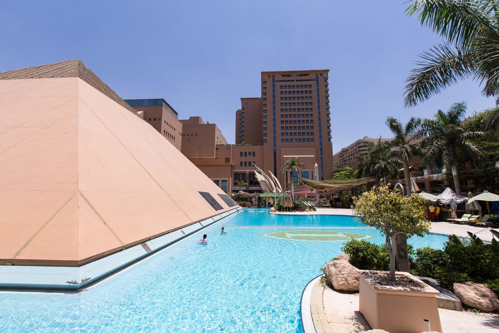 Pool beneath the pyramid-shaped hotel building