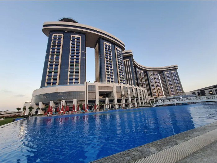 Rixos hotel towers above the pool